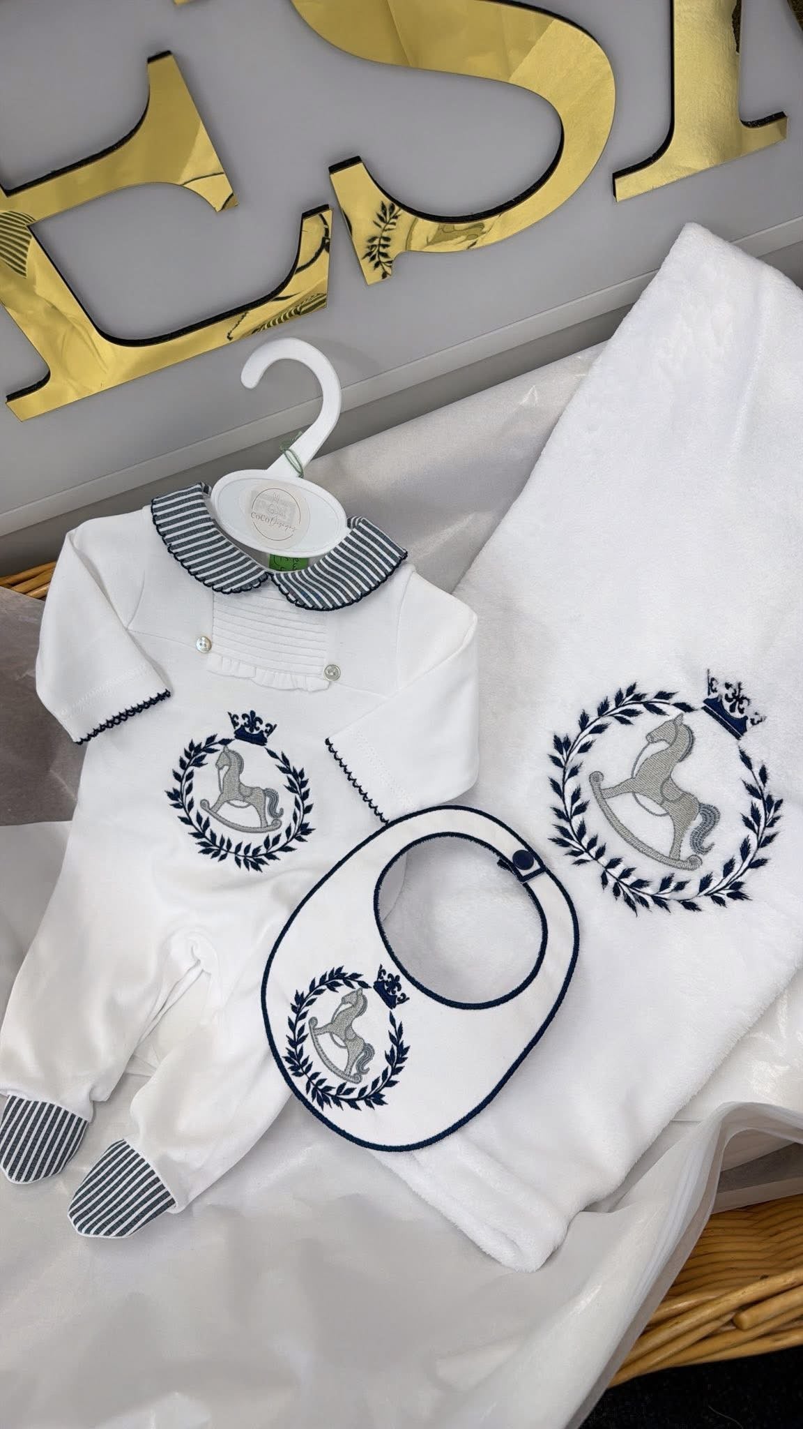 Navy & white babygrow and bib ( blanket sold separately)Rocking horse design