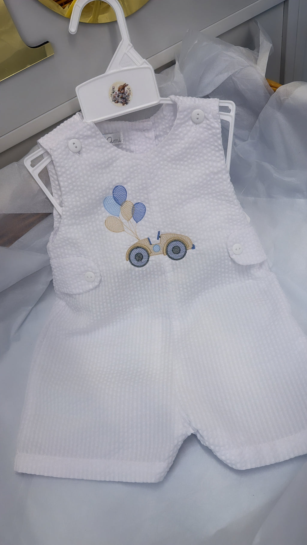 White playsuit with beige car and balloons