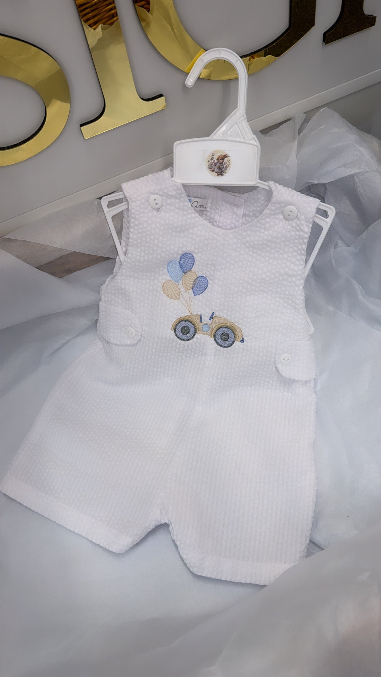 White playsuit with beige car and balloons