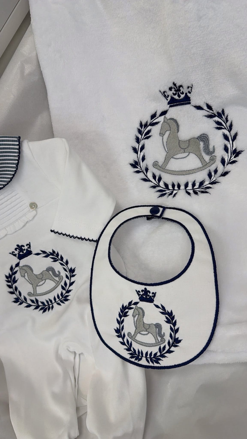 Navy & white babygrow and bib ( blanket sold separately)Rocking horse design
