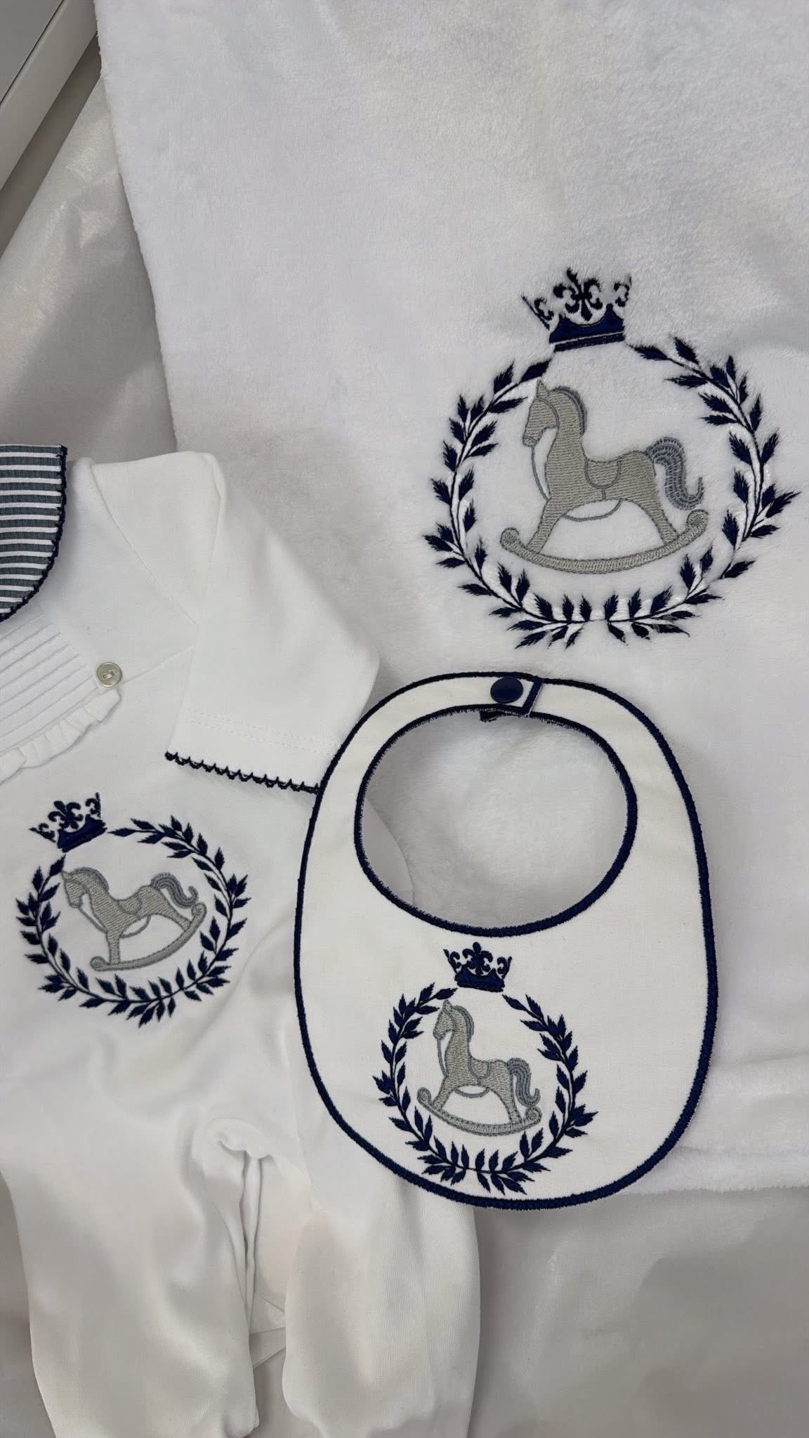 Navy & white babygrow and bib ( blanket sold separately)Rocking horse design