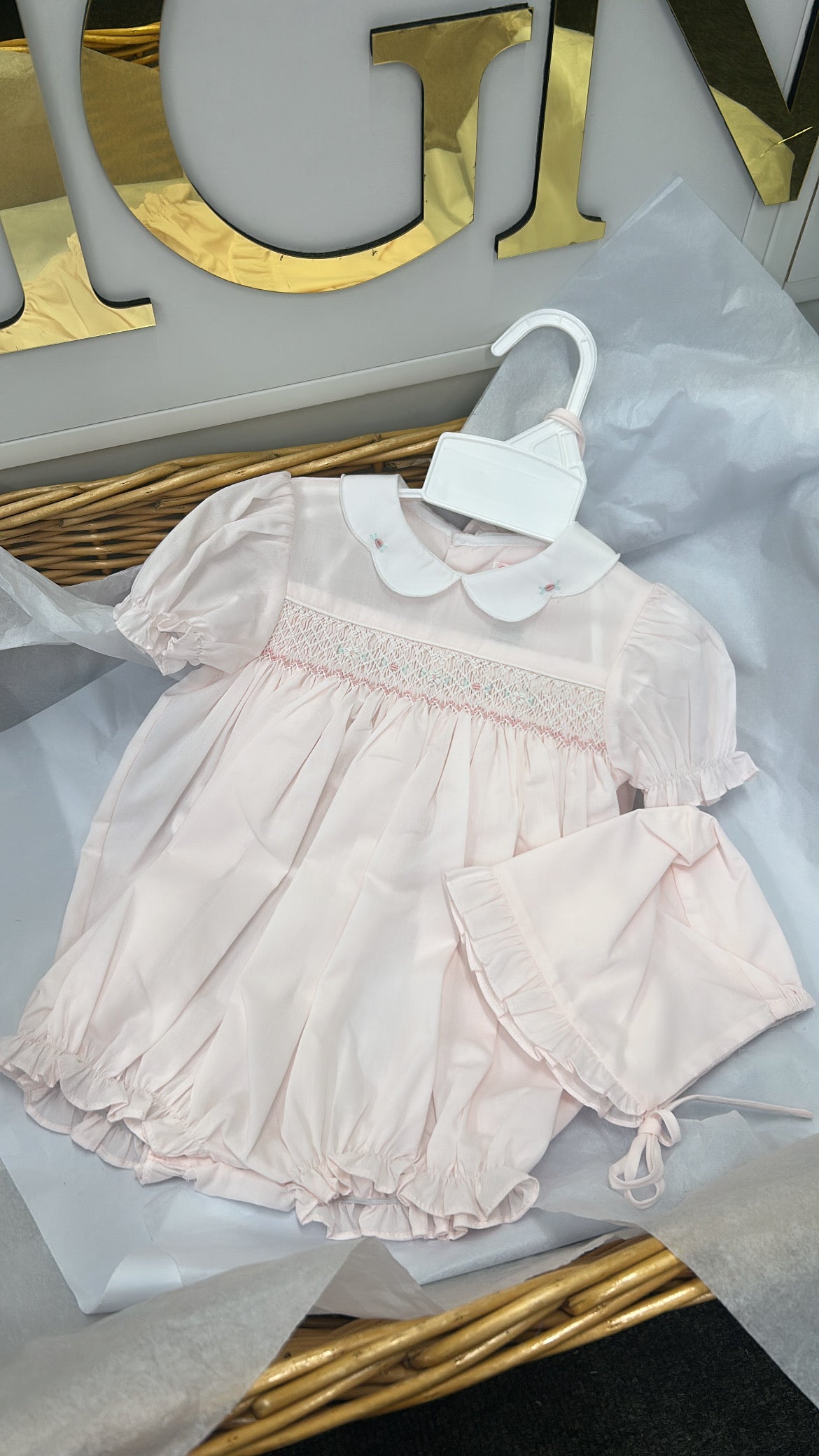 Pink smock romper and bonnet