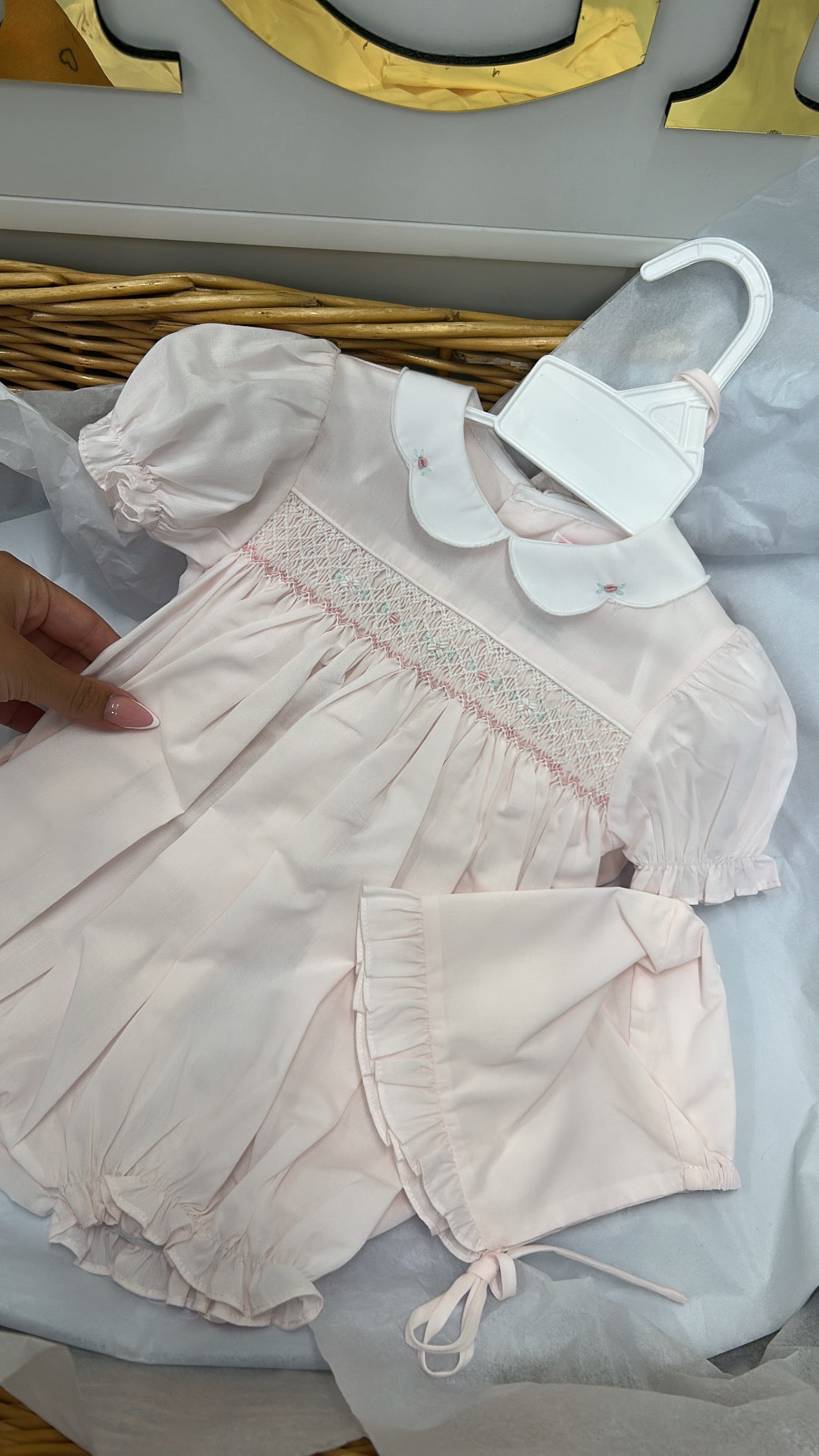 Pink smock romper and bonnet