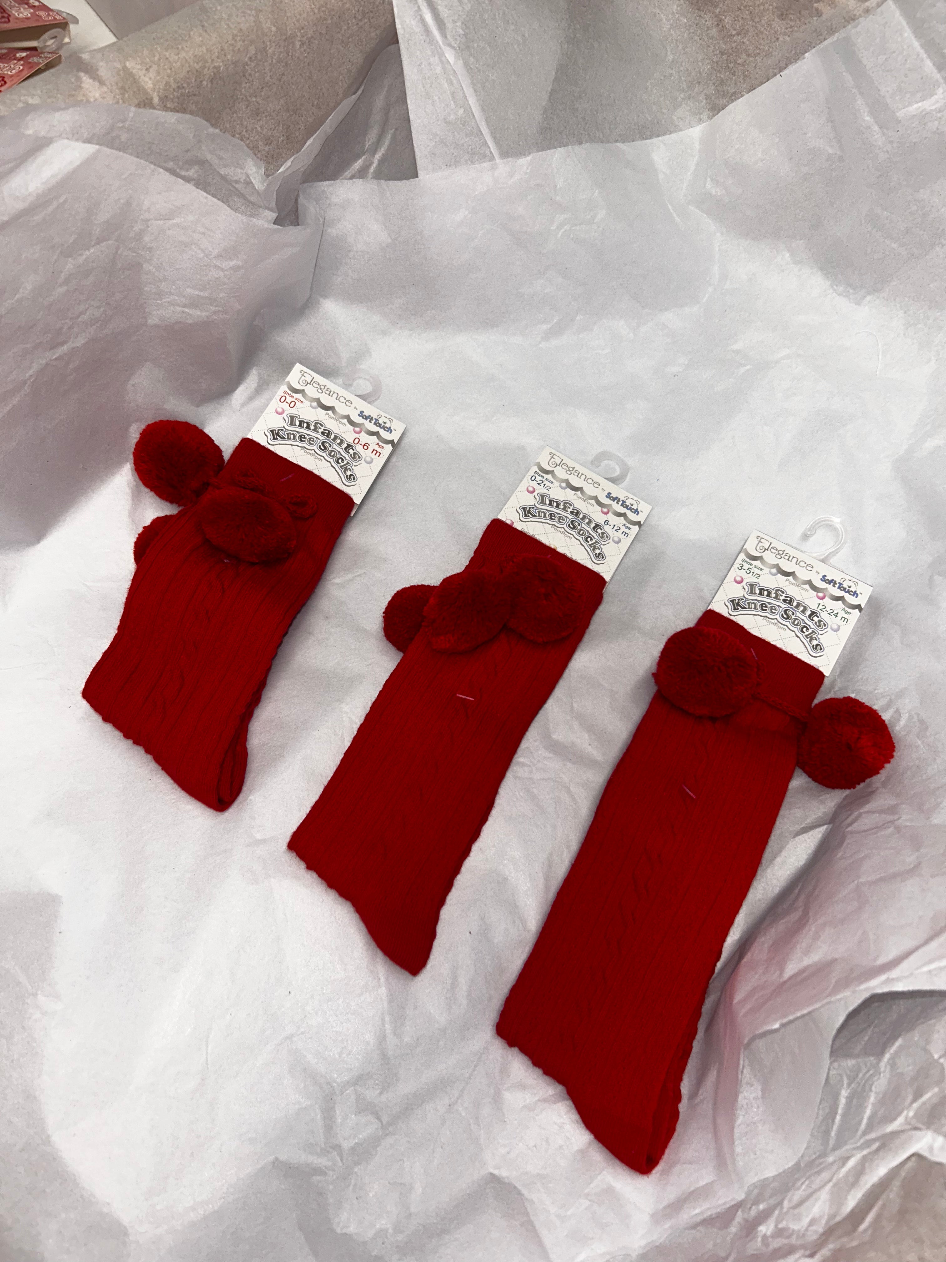 Knee high red socks with pompom