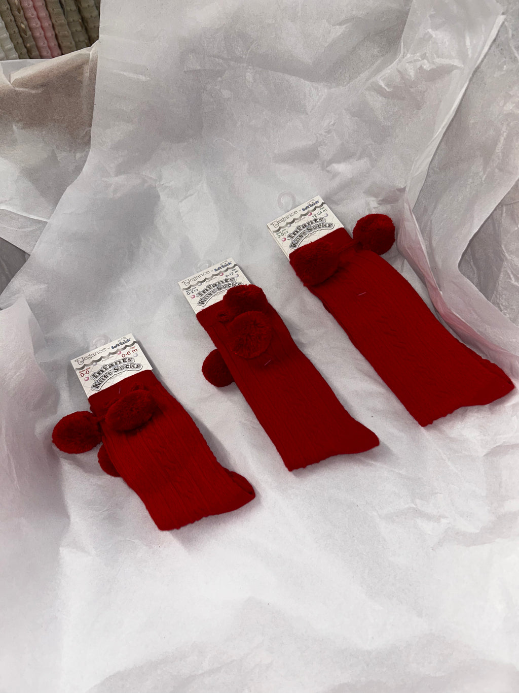 Knee high red socks with pompom