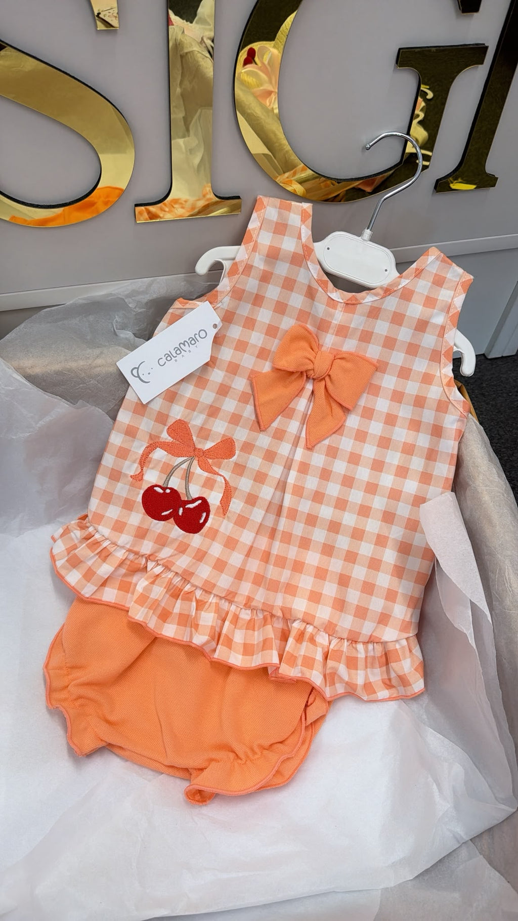 Peach romper with cherrys and matching hat set