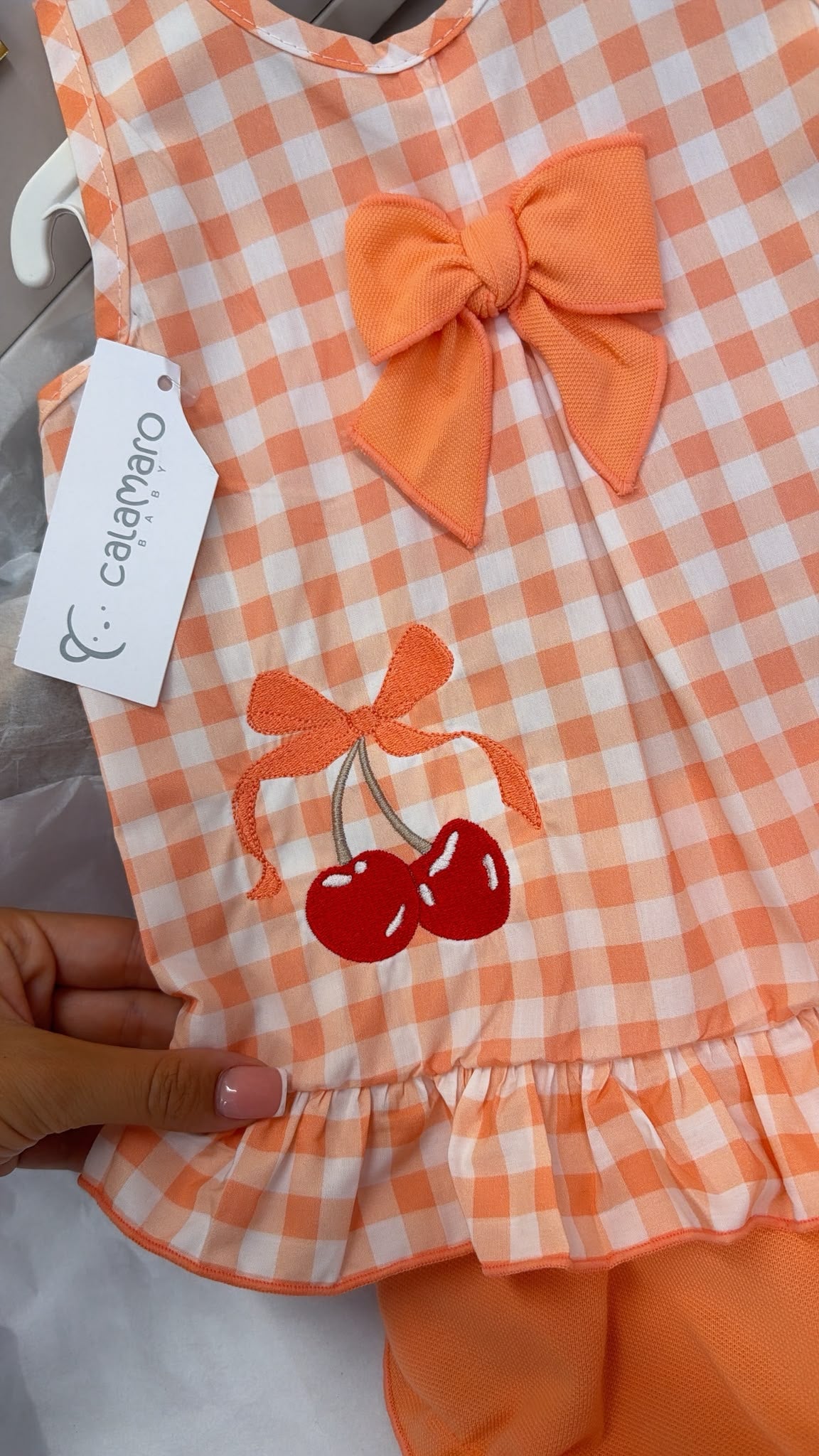 Peach romper with cherrys and matching hat set