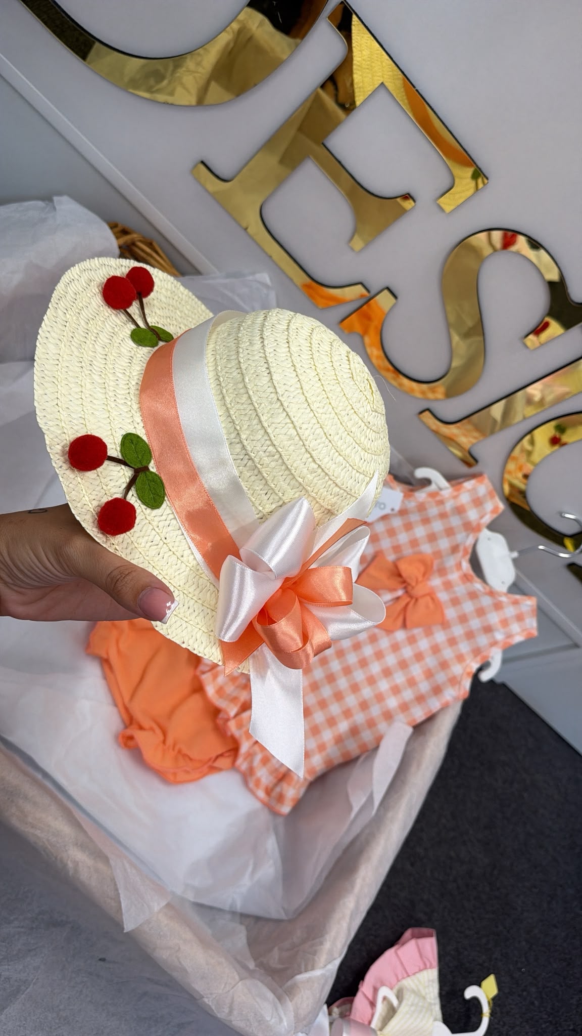 Peach romper with cherrys and matching hat set
