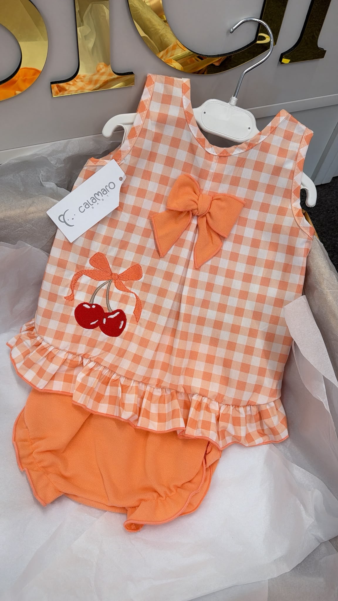 Peach romper with cherrys and matching hat set