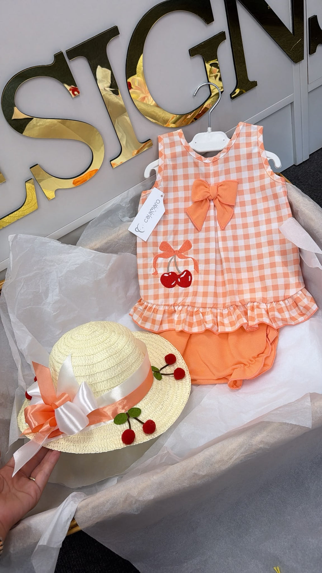 Peach romper with cherrys and matching hat set