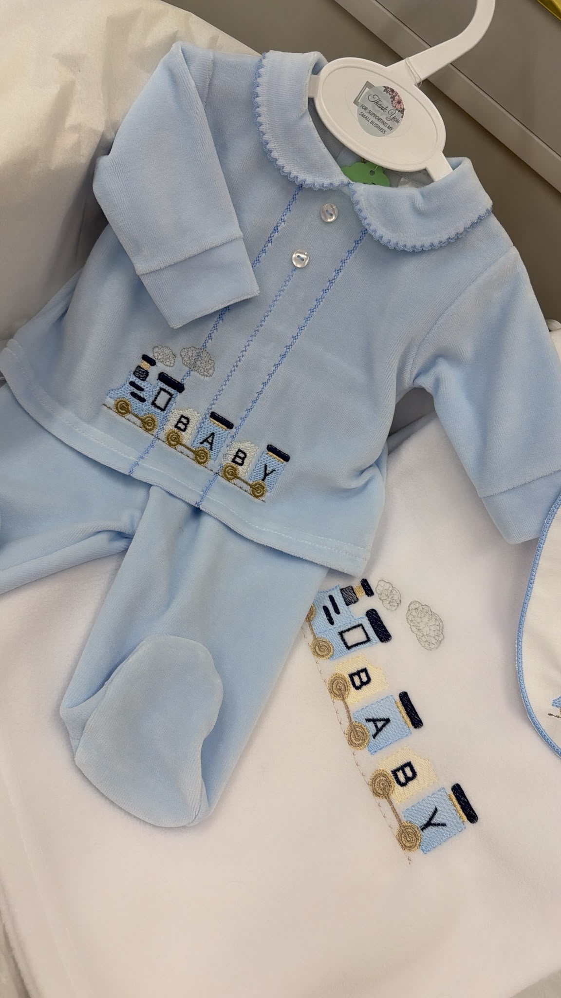 Baby train two piece outfit with matching bib and matching white fleece blanket