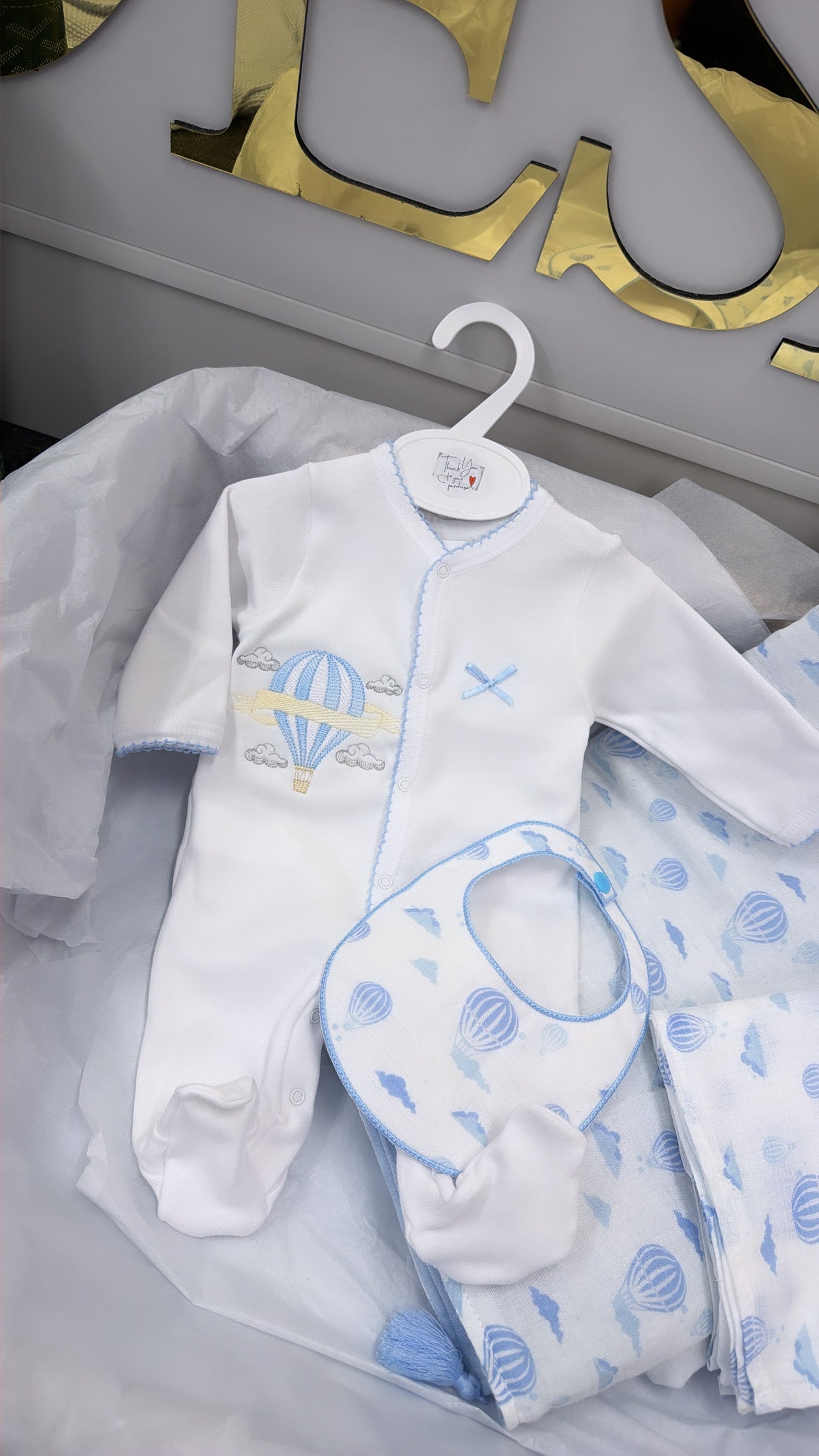 Blue trim hot air balloon full set: blanket babygrow and bib and muslin