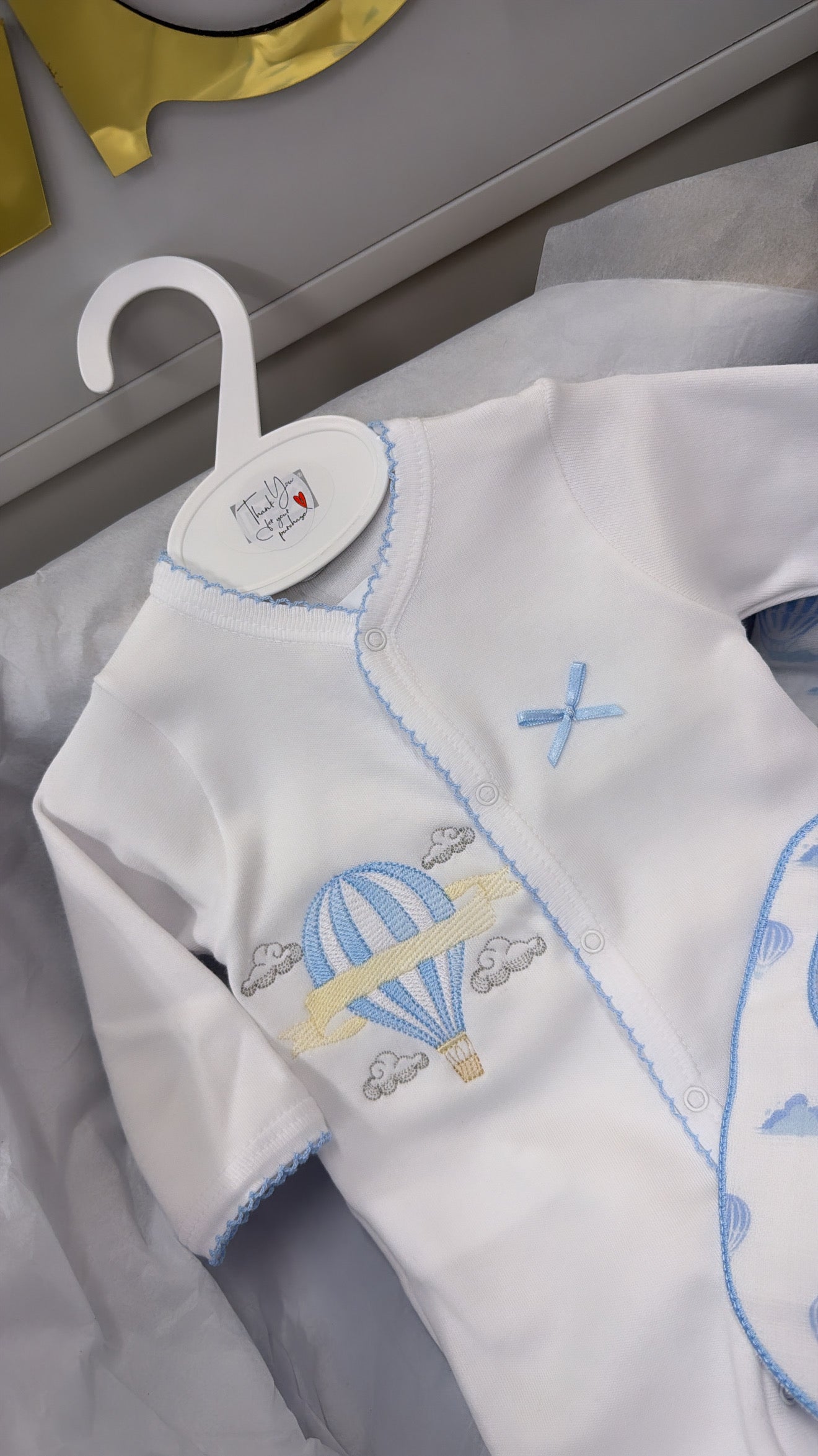 Blue trim hot air balloon full set: blanket babygrow and bib and muslin