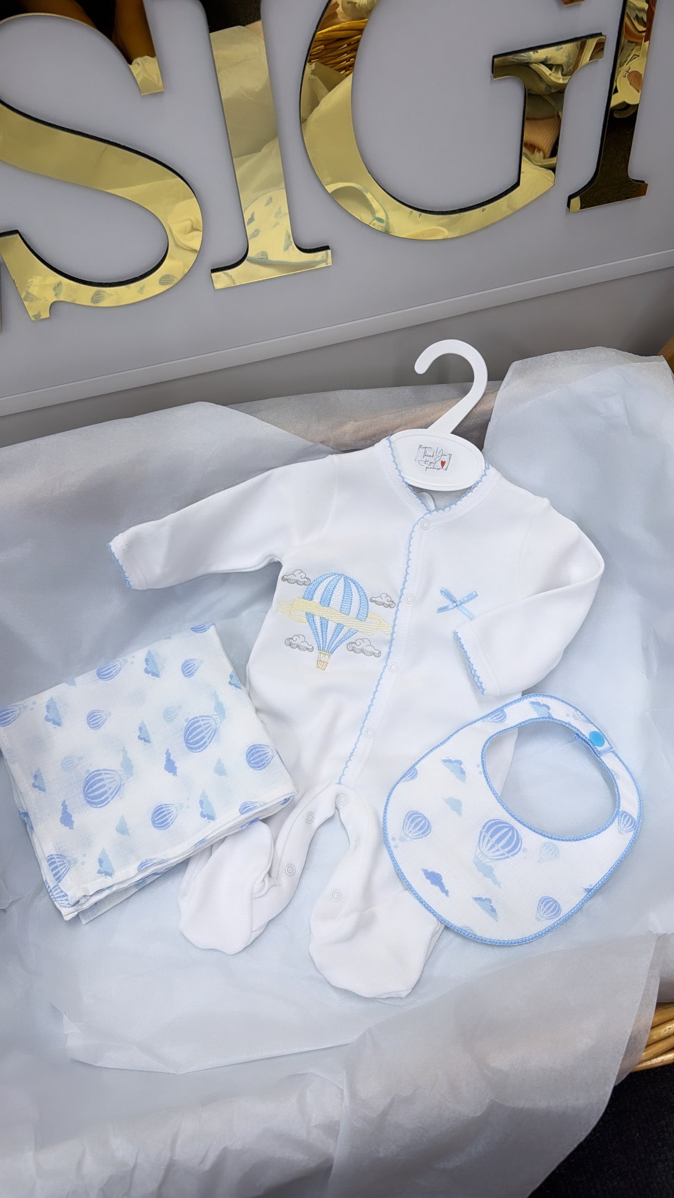 Blue trim hot air balloon babygrow,bib and muslin
