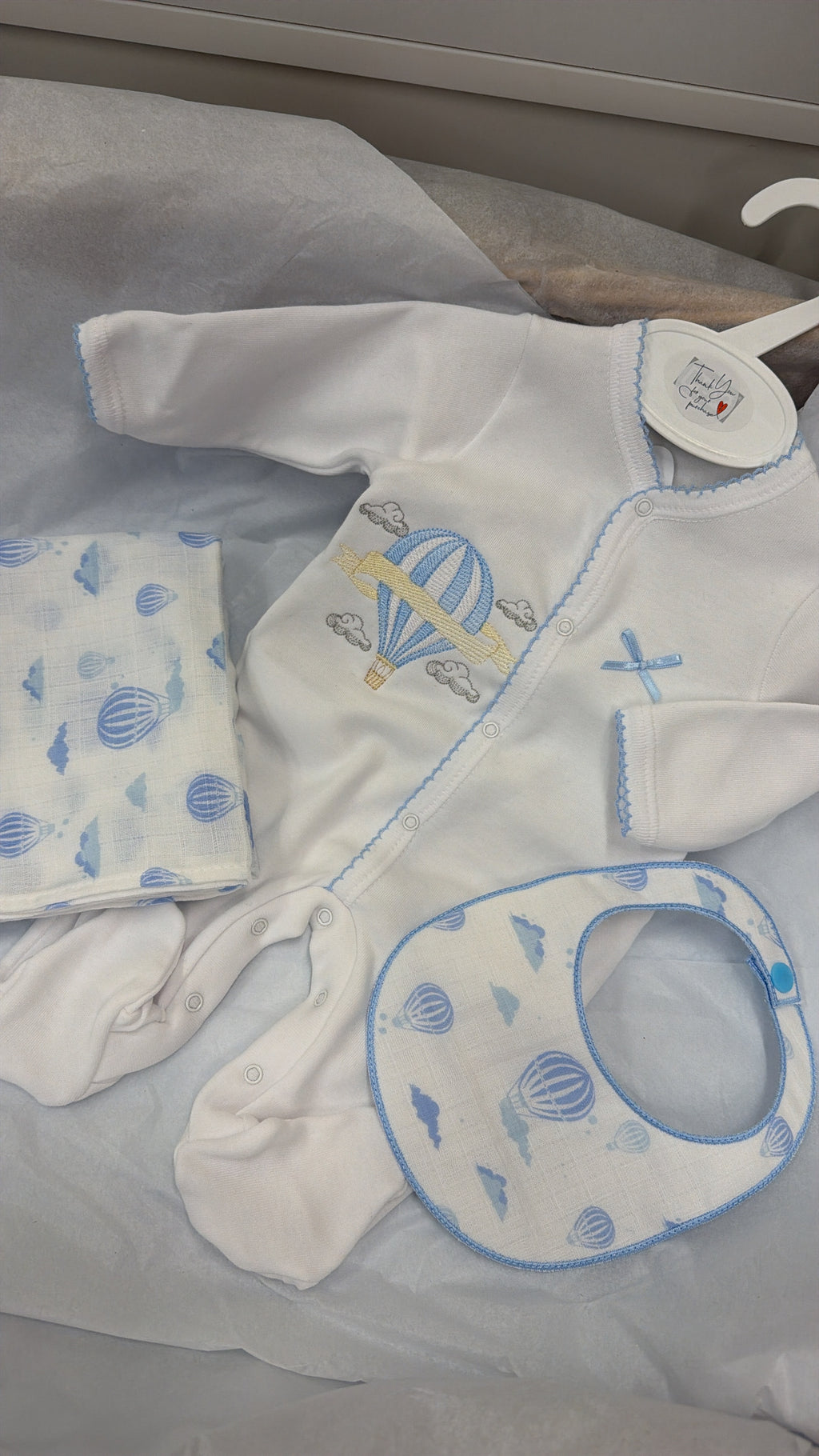 Blue trim hot air balloon babygrow,bib and muslin