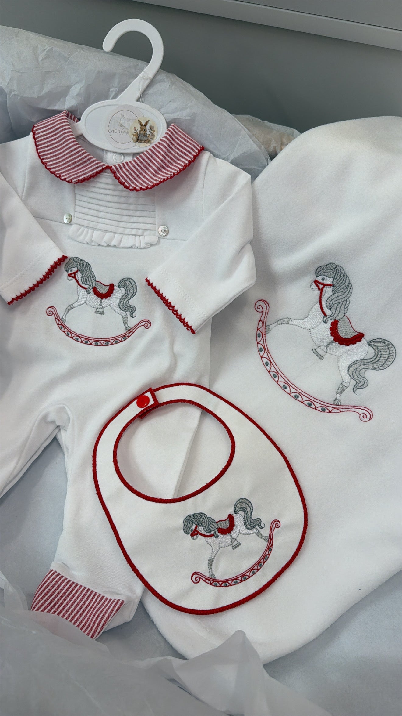 Red rocking horse babygrow&bib blanket sold separately