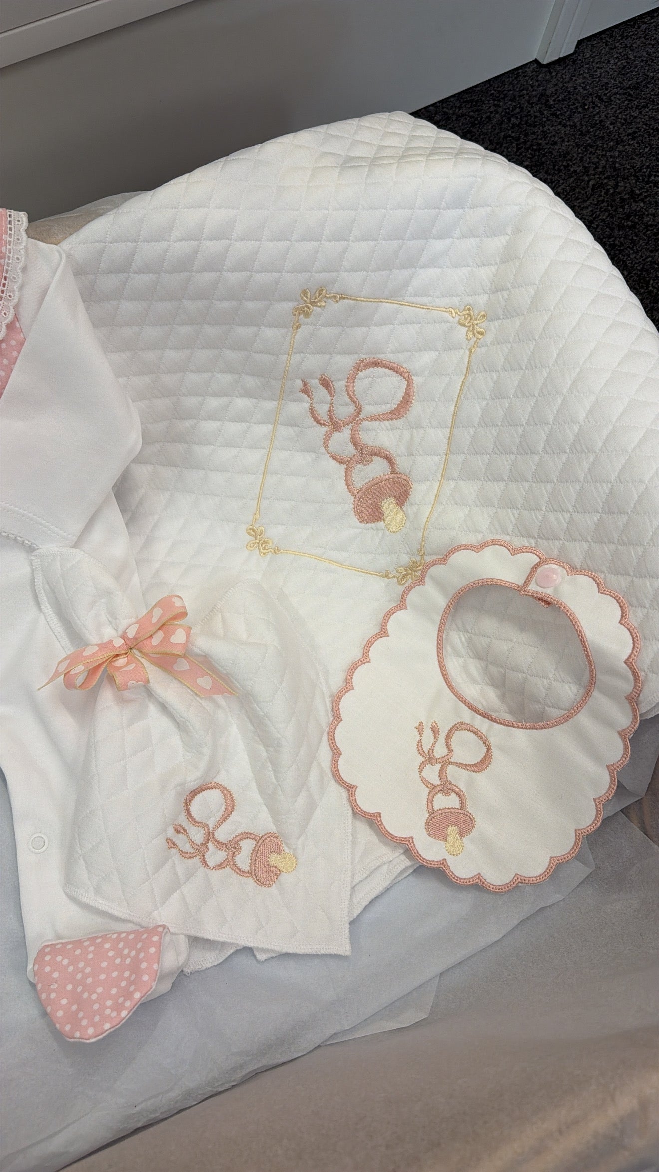 Pink Dummy four piece set: babygrow, bib, comforter and blanket