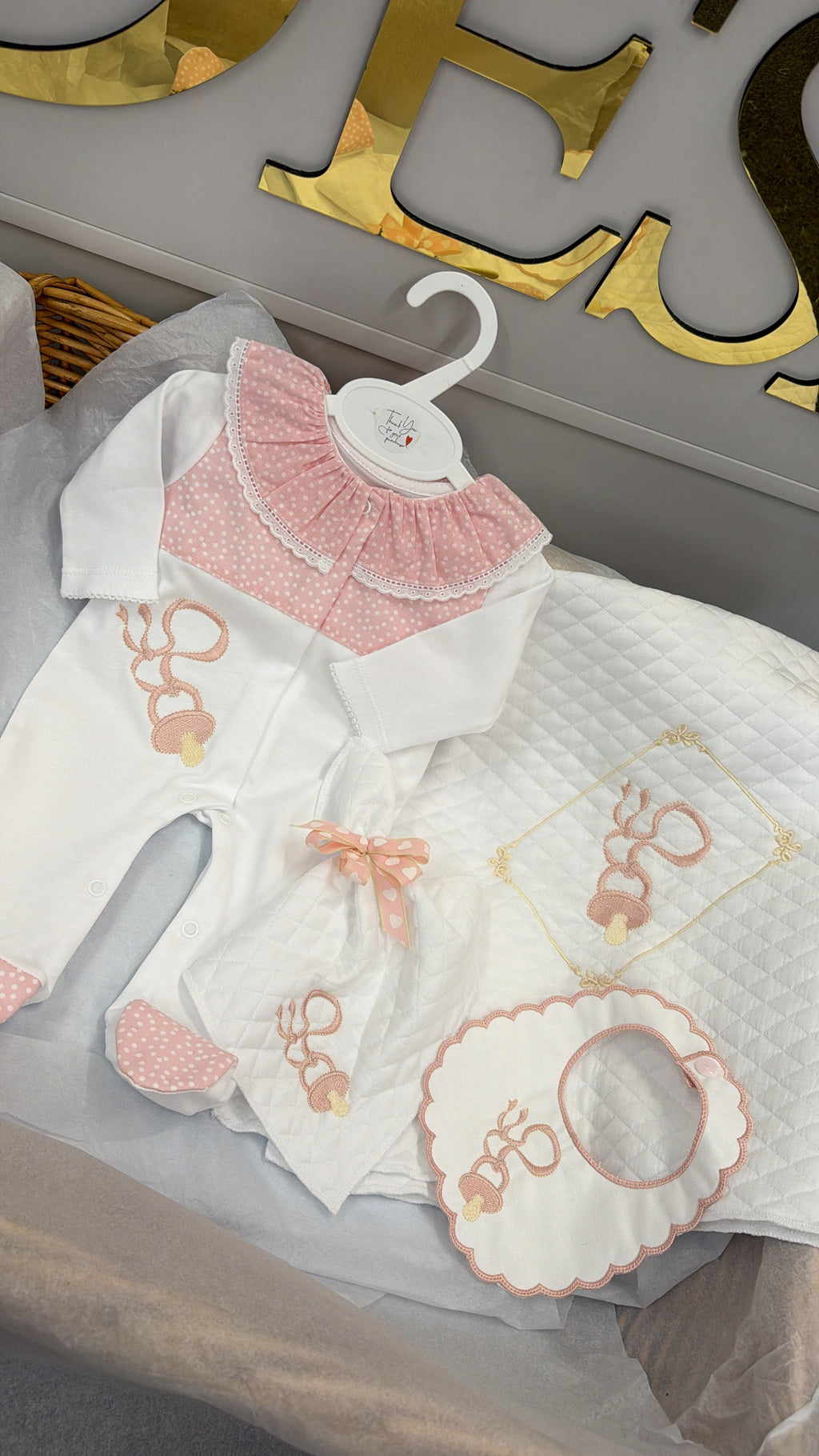Pink Dummy four piece set: babygrow, bib, comforter and blanket