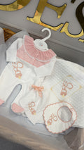 Pink Dummy four piece set: babygrow, bib, comforter and blanket