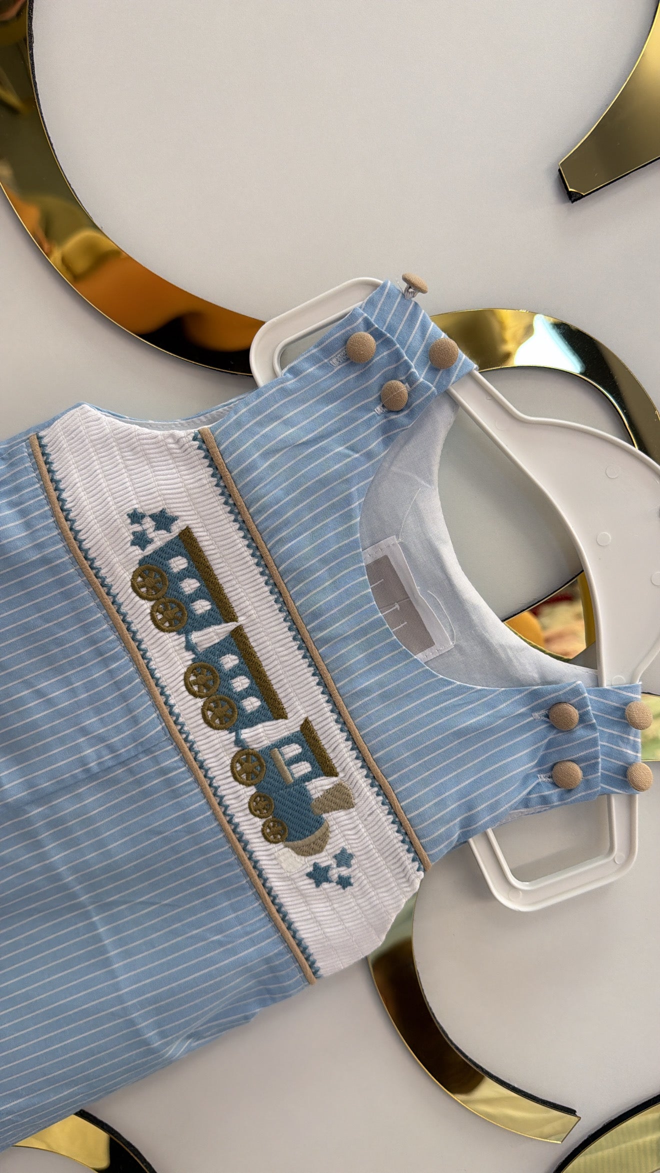 Smocked train dungarees